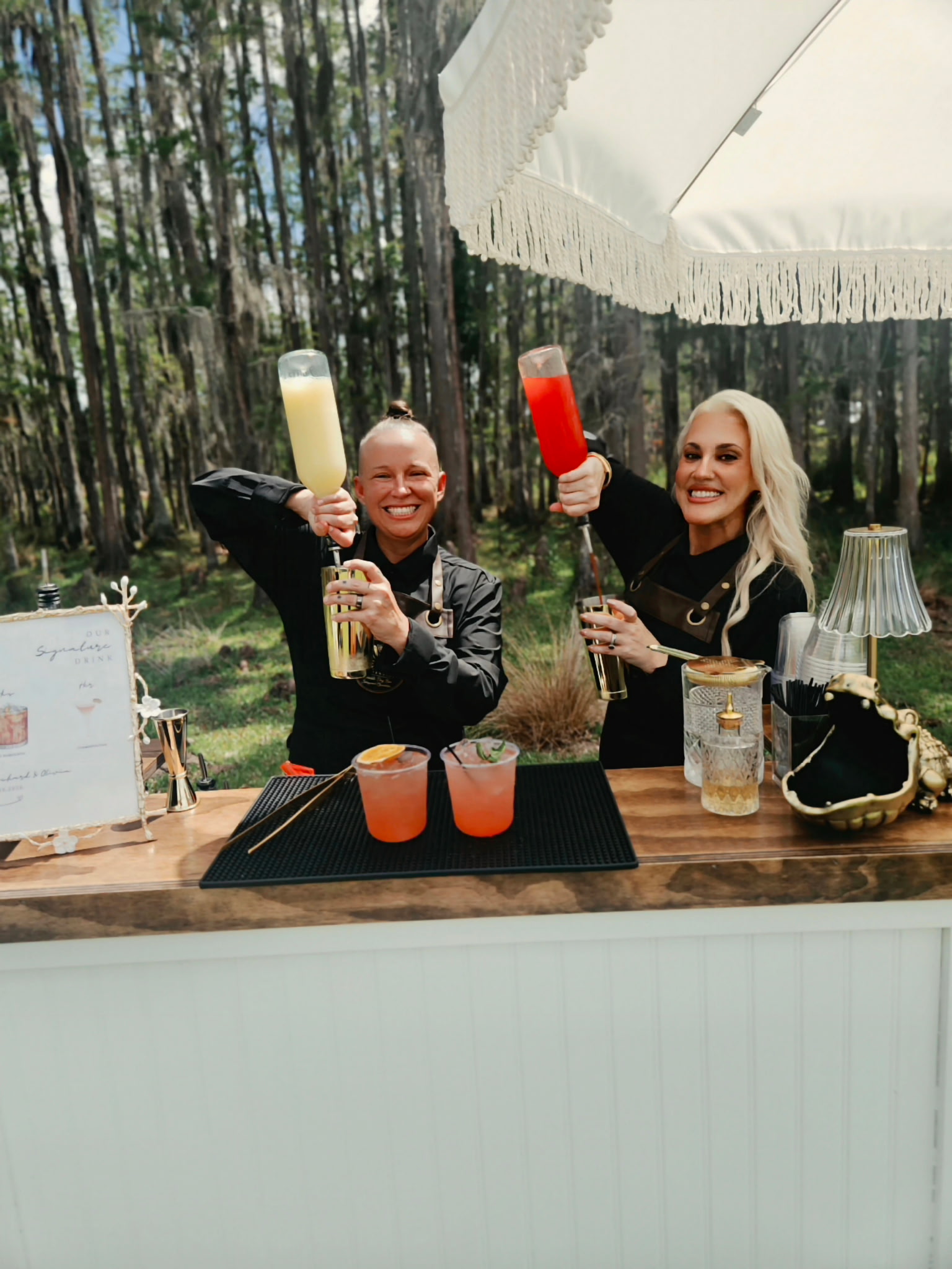 Wilde Reserve bartenders celebrating behind the mobile bar