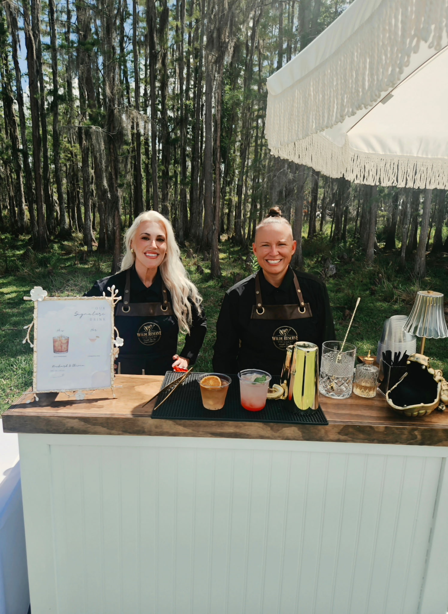 Wilde Reserve bartenders behind their mobile dry bar setup